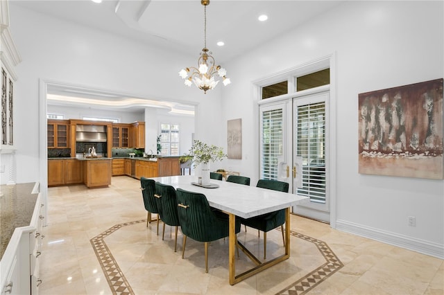 dining space with a notable chandelier