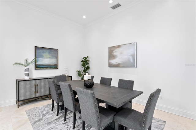 tiled dining space featuring ornamental molding