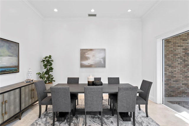 dining room featuring crown molding