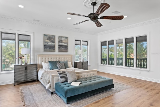 bedroom with ceiling fan and hardwood / wood-style floors