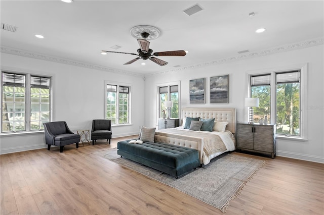 bedroom with ceiling fan and light hardwood / wood-style flooring