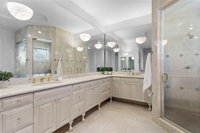 bathroom featuring vanity, tile patterned flooring, a shower with door, and beamed ceiling