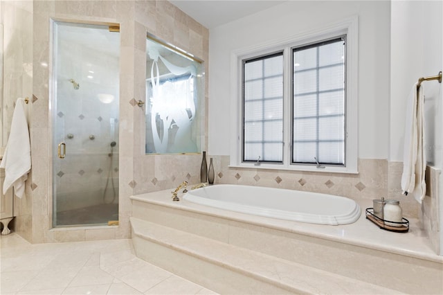 bathroom with plus walk in shower and tile patterned flooring