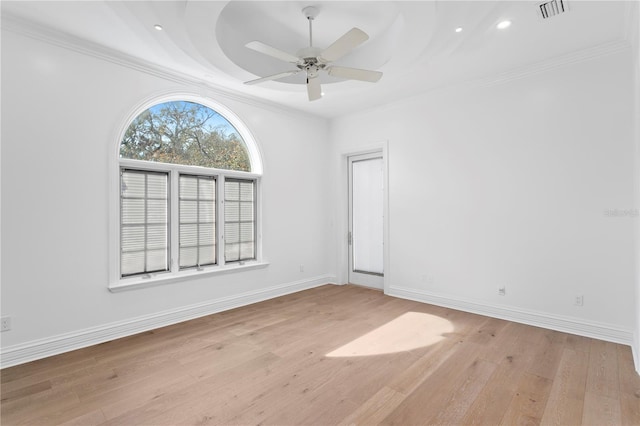 unfurnished room featuring crown molding, ceiling fan, and light hardwood / wood-style flooring