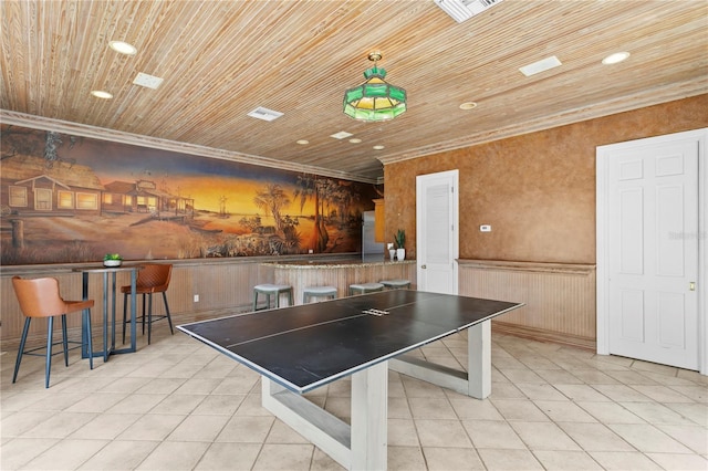 recreation room featuring light tile patterned flooring, wood ceiling, and crown molding