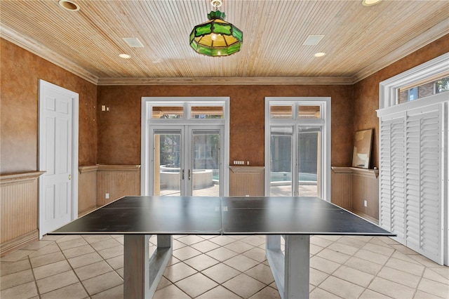 playroom featuring light tile patterned flooring, wooden ceiling, crown molding, and french doors