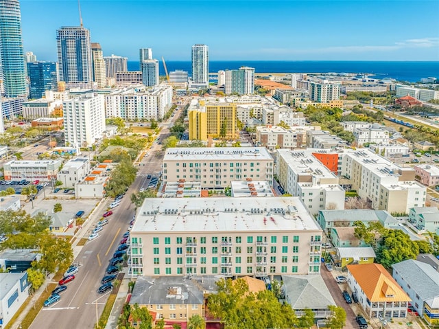 drone / aerial view featuring a view of city and a water view