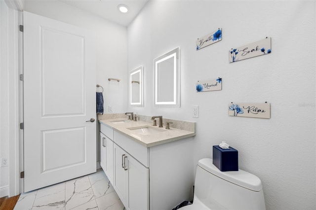 644 3rd Ave S Unit 305, Saint Petersburg, FL 33701 - bathroom with double vanity, marble look tile flooring, and recessed lighting