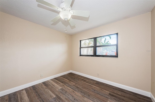 empty room featuring ceiling fan, dark hardwood / wood-style floors, and a textured ceiling