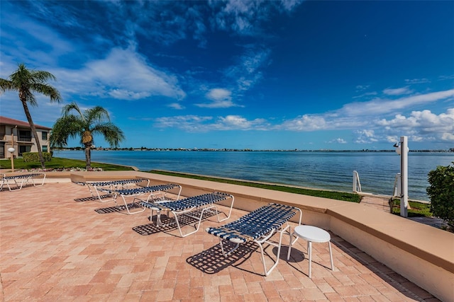 view of patio featuring a water view