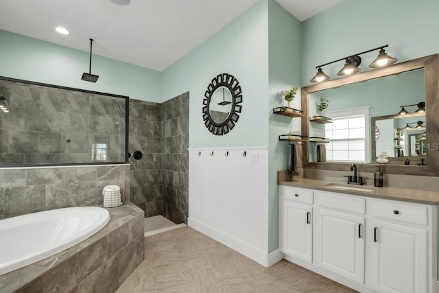 bathroom featuring vanity and separate shower and tub