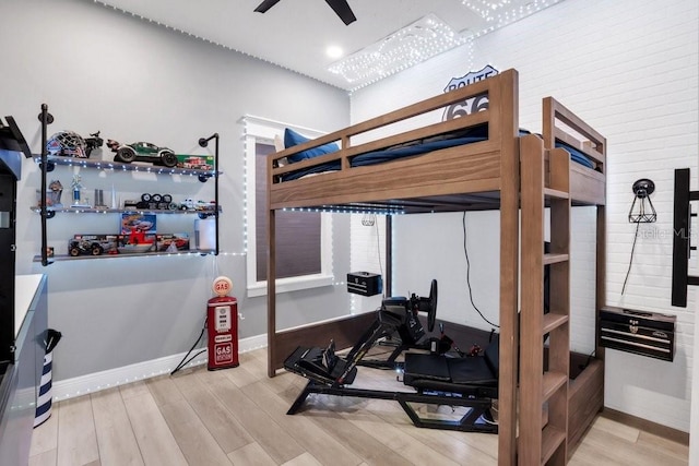 bedroom with hardwood / wood-style flooring and ceiling fan