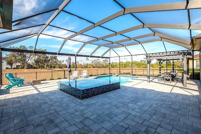 view of swimming pool with an in ground hot tub, a pergola, glass enclosure, and a patio