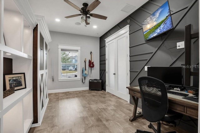 office area with baseboards, recessed lighting, light wood-style flooring, a ceiling fan, and visible vents