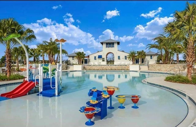 community pool with a water slide
