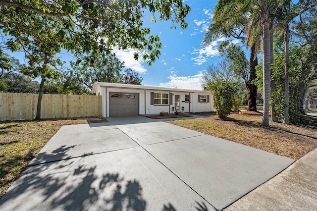 single story home featuring a garage