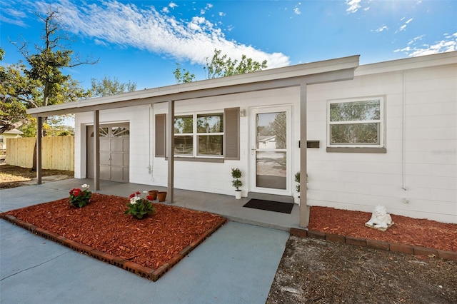 entrance to property featuring a garage