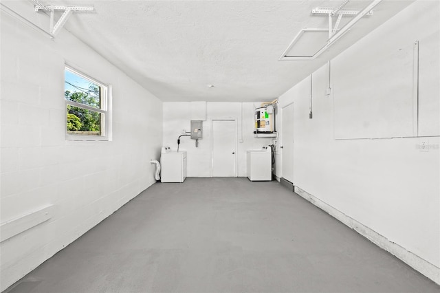 garage with washer / clothes dryer and electric panel