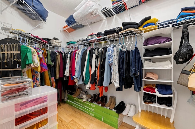 walk in closet featuring hardwood / wood-style floors