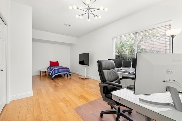 office with a notable chandelier and hardwood / wood-style flooring