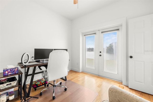 home office featuring french doors and light hardwood / wood-style flooring