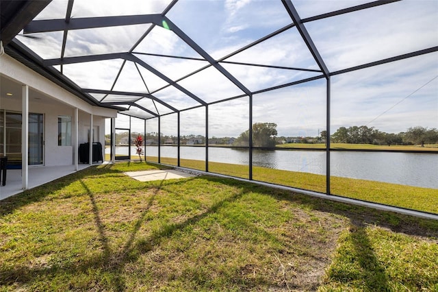 exterior space with a water view and a lanai