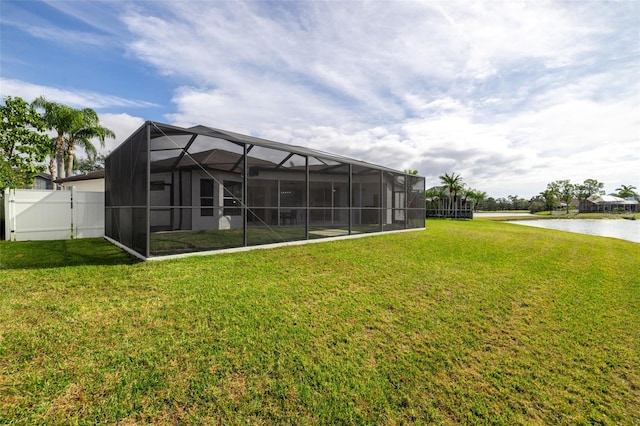 exterior space with a water view and a lanai