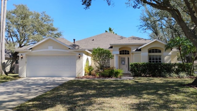 single story home with a garage and a front yard