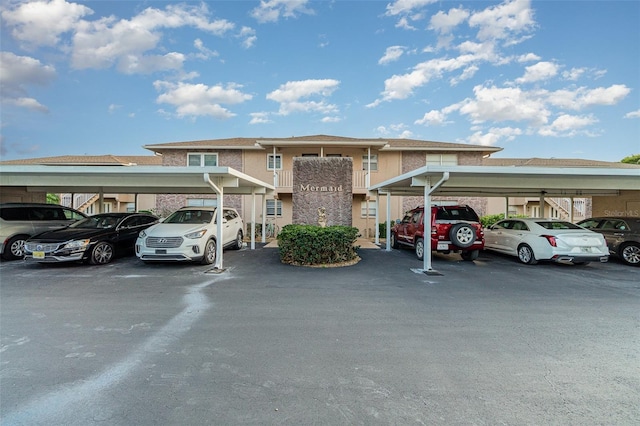 view of front of home featuring a carport