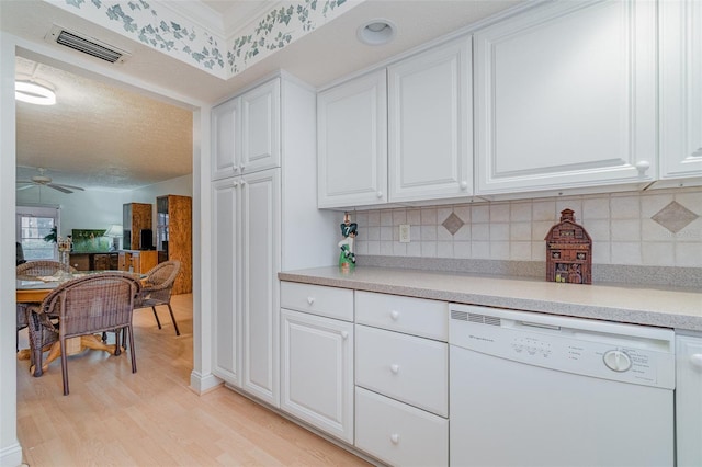 kitchen featuring white cabinetry, light wood-type flooring, ceiling fan, and white dishwasher