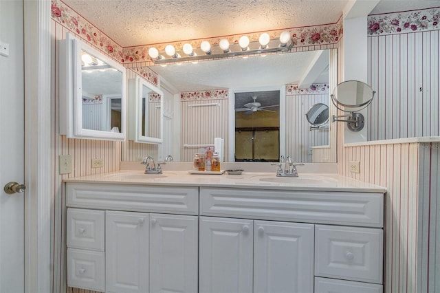 bathroom featuring vanity and a textured ceiling