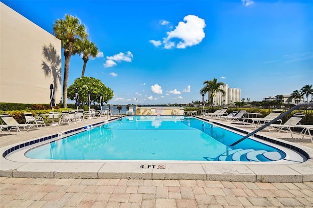 view of swimming pool featuring a patio area