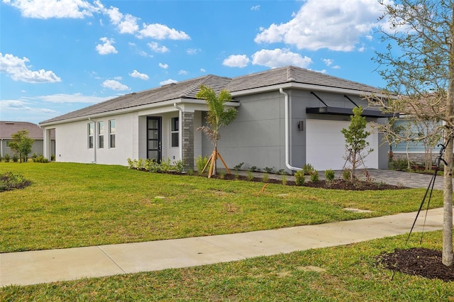 view of front facade with a garage and a front yard