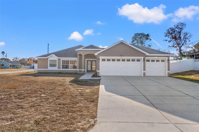 ranch-style house featuring a garage