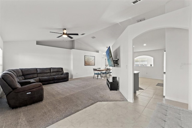 living room featuring ceiling fan, light colored carpet, and lofted ceiling