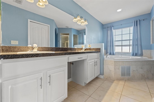 bathroom with vanity, shower with separate bathtub, and tile patterned flooring