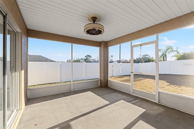 unfurnished sunroom featuring a wealth of natural light