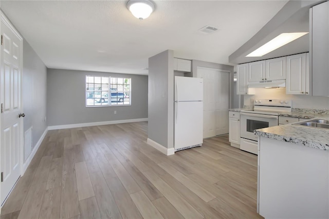 kitchen featuring white appliances, sink, light hardwood / wood-style floors, and white cabinets