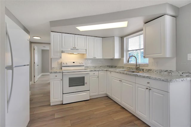 kitchen featuring white cabinetry, sink, white appliances, and light hardwood / wood-style floors