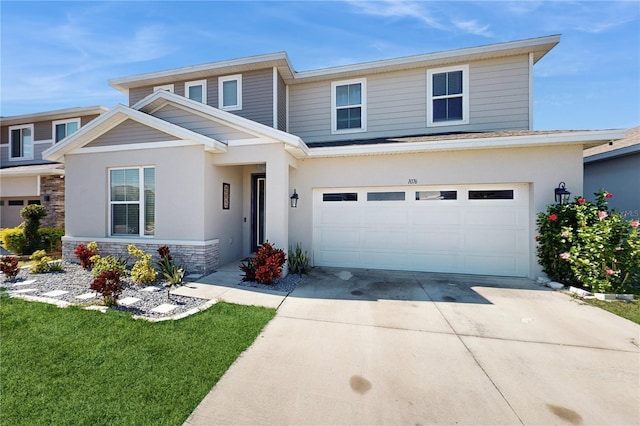 view of front of home featuring a garage and a front lawn