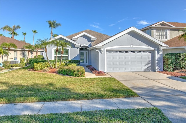 view of front of property featuring a garage and a front lawn