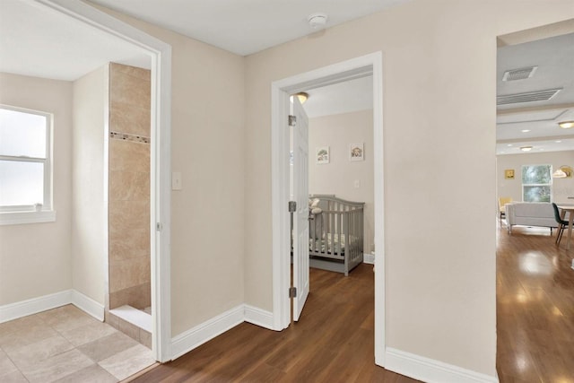 hallway featuring hardwood / wood-style flooring