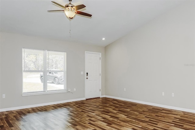 unfurnished room featuring hardwood / wood-style flooring, vaulted ceiling, and ceiling fan