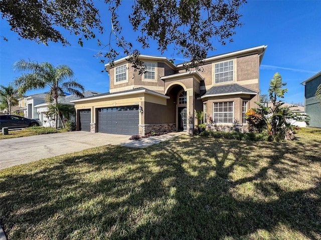 view of front of property featuring a garage and a front yard