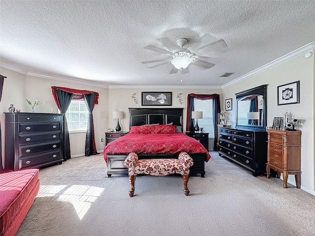 bedroom with ceiling fan, light colored carpet, ornamental molding, and a textured ceiling