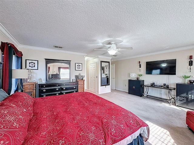 bedroom featuring ceiling fan, ornamental molding, carpet floors, and a textured ceiling