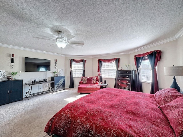 bedroom with crown molding, ceiling fan, carpet, and a textured ceiling