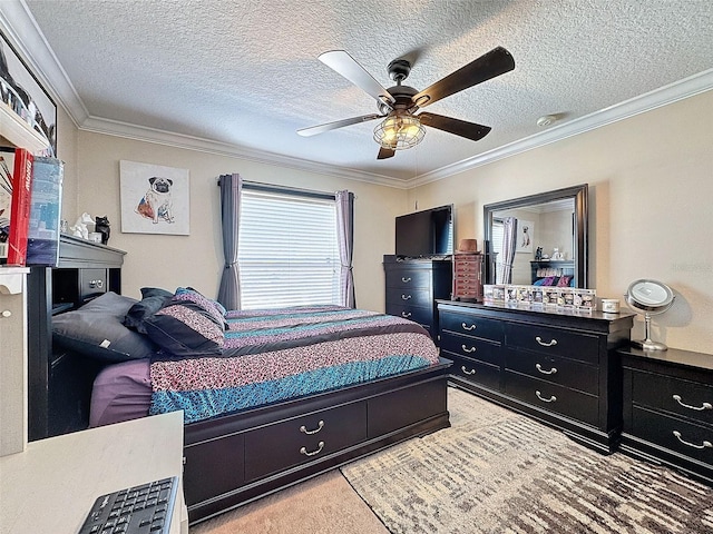 bedroom with ceiling fan, ornamental molding, and a textured ceiling