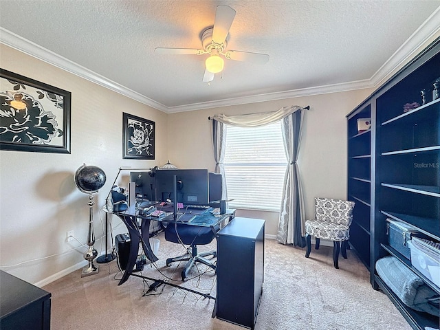 home office with ceiling fan, ornamental molding, carpet, and a textured ceiling