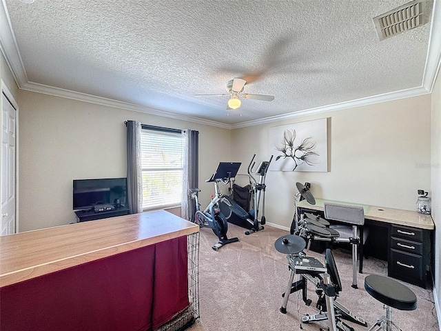 office area featuring ornamental molding, light colored carpet, a textured ceiling, and ceiling fan